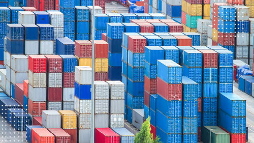 Colorful containers stacked vertically at a port