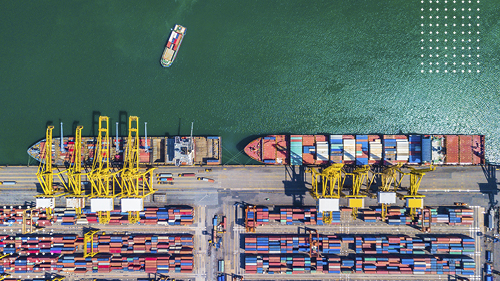 Containers on ship docked at port in the ocean
