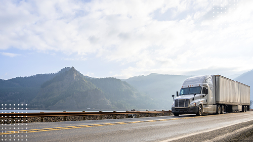 Truck_Driving_on_Road_Near_Mountains_GRI_Season_Blog_Image